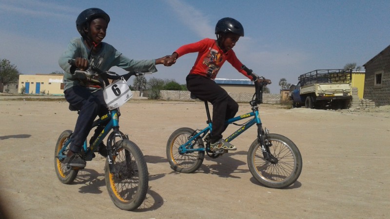 Two children holding hands