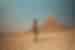 Traveller walking by the Great Pyramids of Giza
