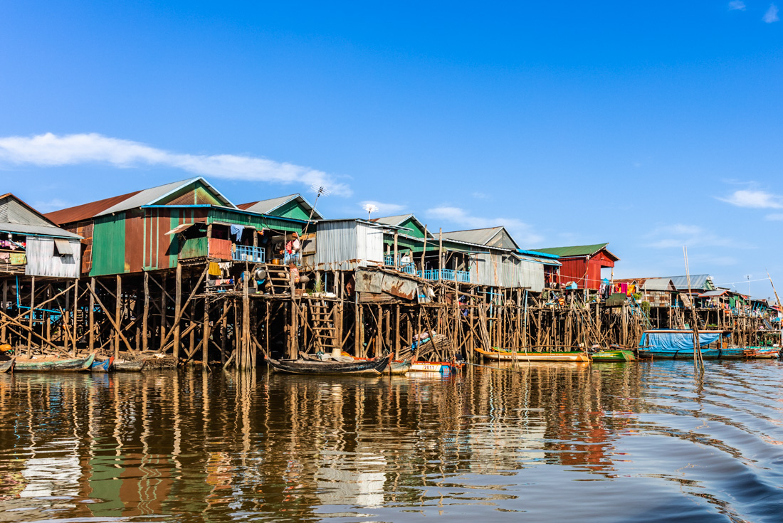 Kampong Phluk houses on high stilts stand in a river