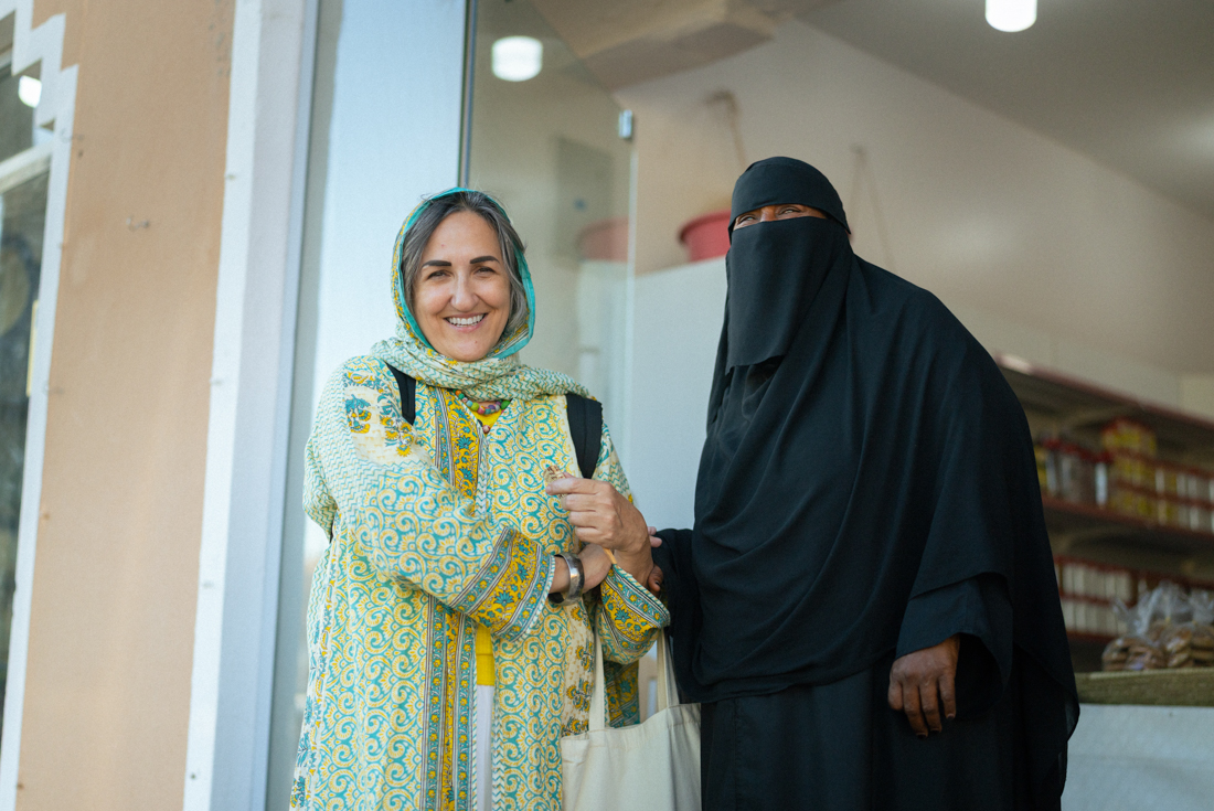 Leader Ammal with a local in Hail outside a market shop in Saudi Arabia