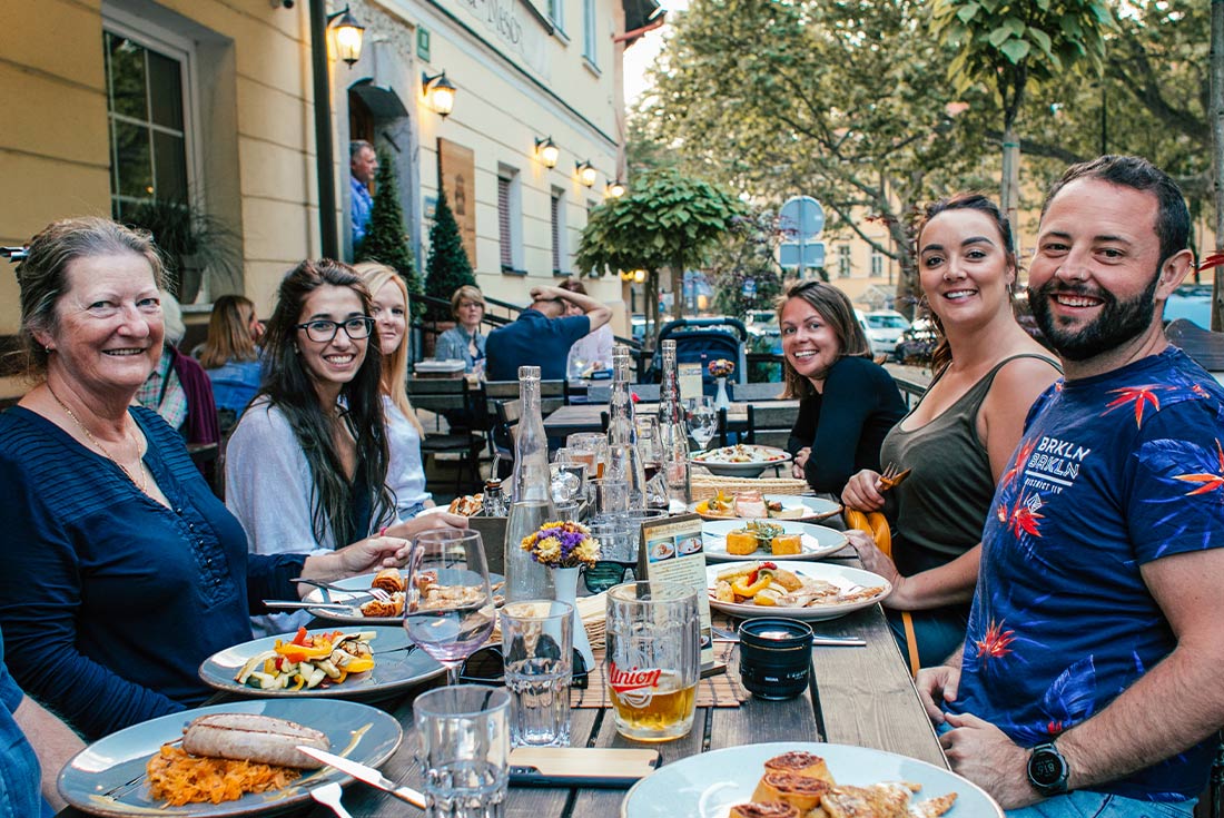 Intrepid group enjoying a meal outside in Ljublijana