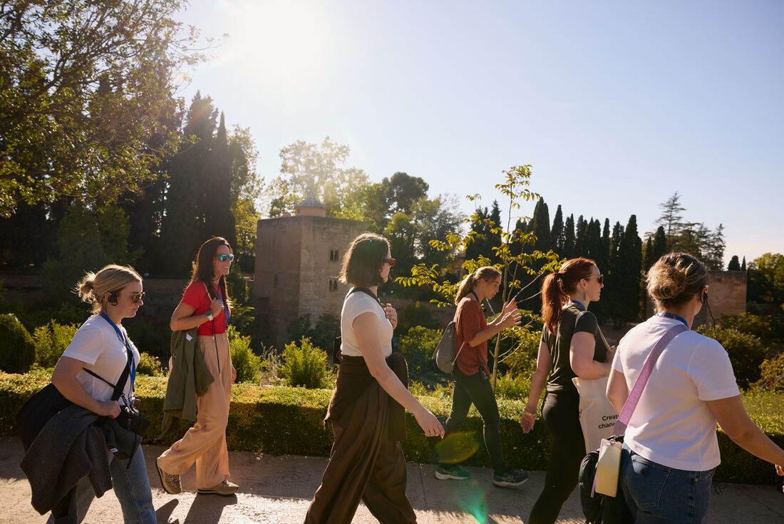 Traveller group walking with Leader in Generalife Garden, Granada, Andalucia, Spain