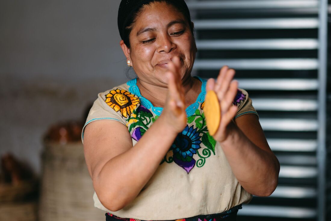 Local teacher of a tortilla making class in Antigua with El Comalote in Guatemala