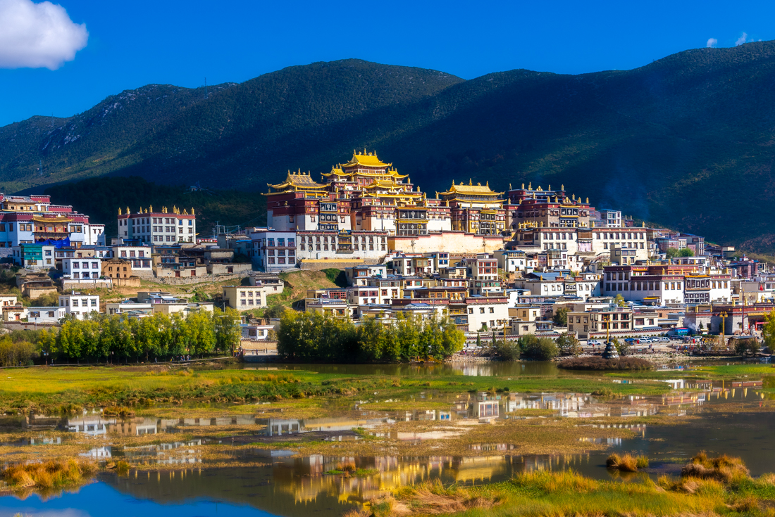 Golden rooves of Sumtsenling Monastery atop the town of Shangri-La, Yunnan Province, China