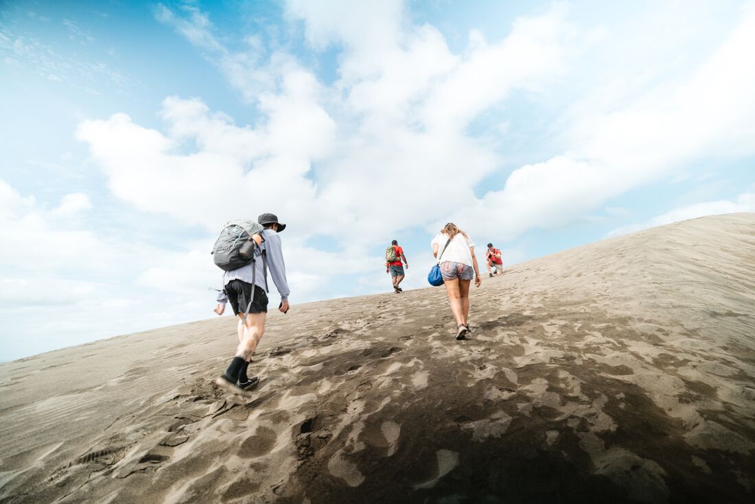 Group hiking up the Sigatoka Sand Dunes in Fiji