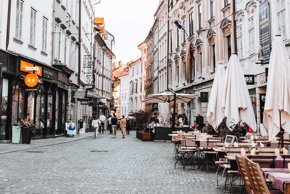 Cafes and ornate buildings on the streets of Ljubljana 