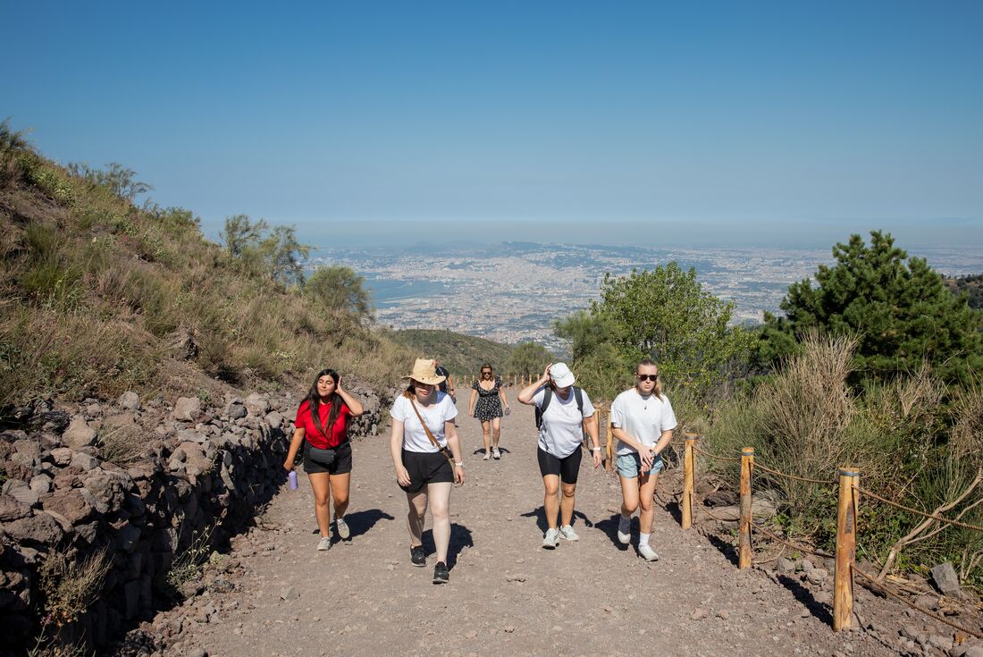 Intrepid travellers and leader hiking Mt Vesuvius near Pompeii, Italy