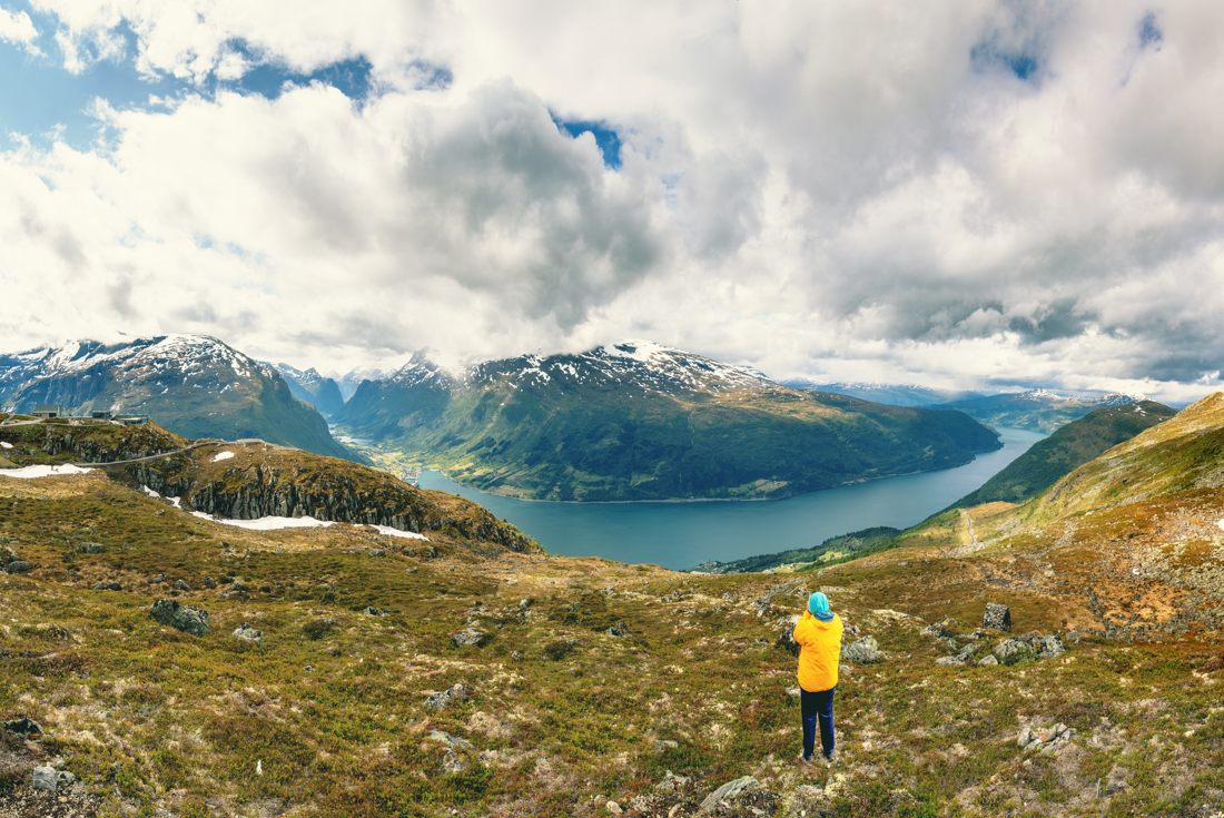 Intrepid traveller taking in view of fjords from Leon Skylift hike in Norway
