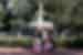 Travellers pose for a group shot in front of the Forsyth Park Fountain in Savannah Georgia USA