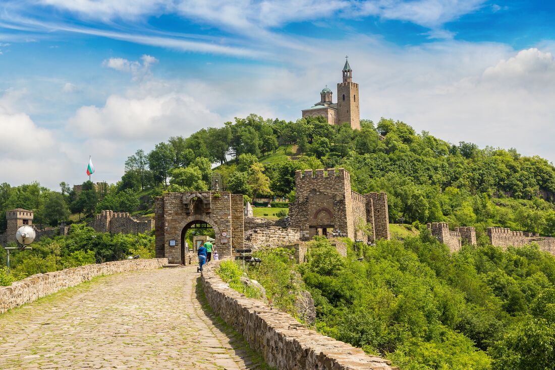 Travellers cross the bridge to Tsarevets Fortress in Veliko Tarnovo, Bulgaria