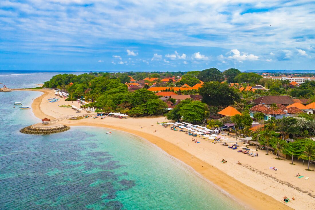 Aerial shot of the coastline along Sanur Beach, located on the southeast coast of Bali, Indonesia 